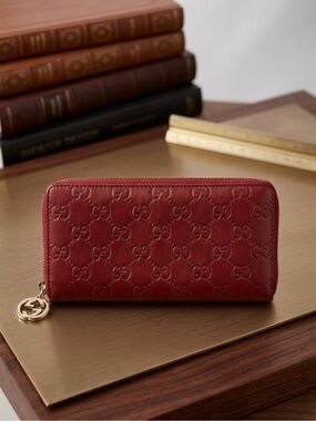 Gucci Red Embossed GG Leather Zip Wallet with Gold Charm